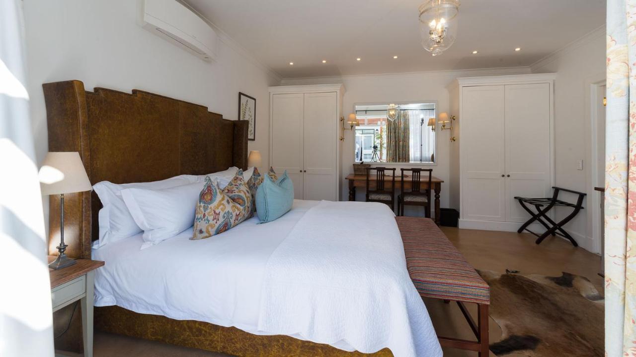 Drostdy Hotel by NEWMARK Graaff-Reinet Exteriér fotografie A bedroom at the Cape Heritage