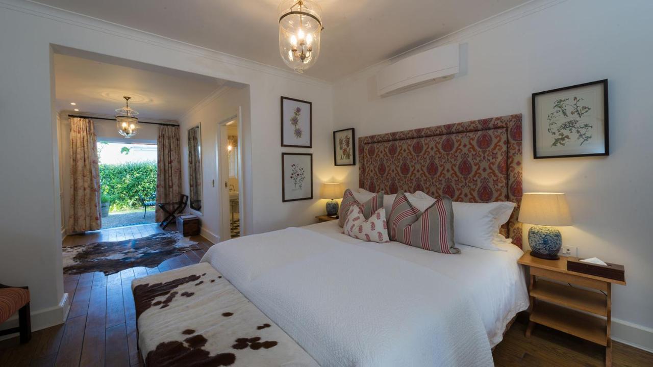 Drostdy Hotel by NEWMARK Graaff-Reinet Exteriér fotografie A bedroom at the Cape Heritage
