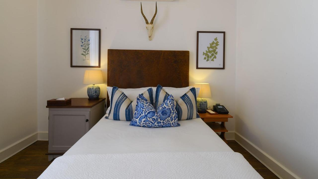 Drostdy Hotel by NEWMARK Graaff-Reinet Exteriér fotografie A bedroom at the hotel