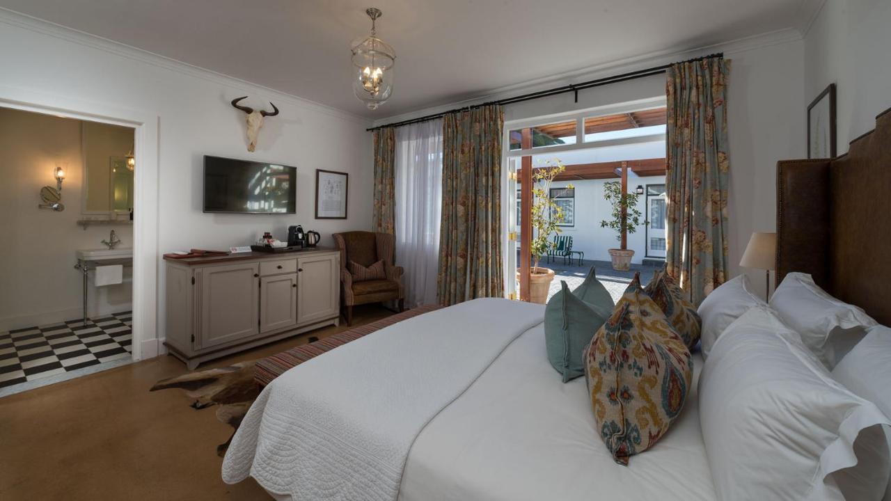 Drostdy Hotel by NEWMARK Graaff-Reinet Exteriér fotografie A bedroom at the Cape Heritage