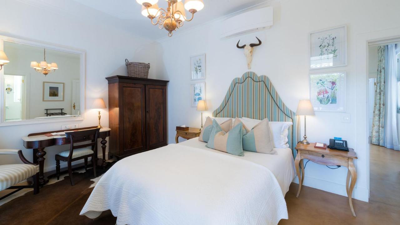 Drostdy Hotel by NEWMARK Graaff-Reinet Exteriér fotografie A bedroom at the Cape Heritage